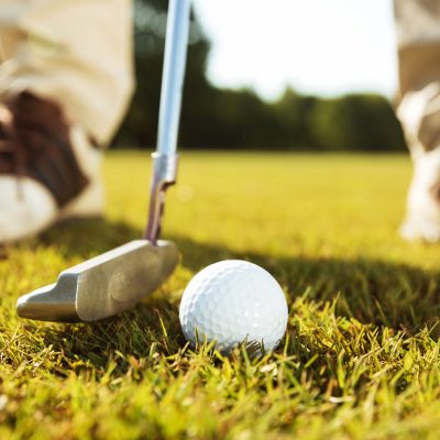 Tee off Shot | Golf ball on a course, perfect for sports enthusiasts visiting Liverpool.